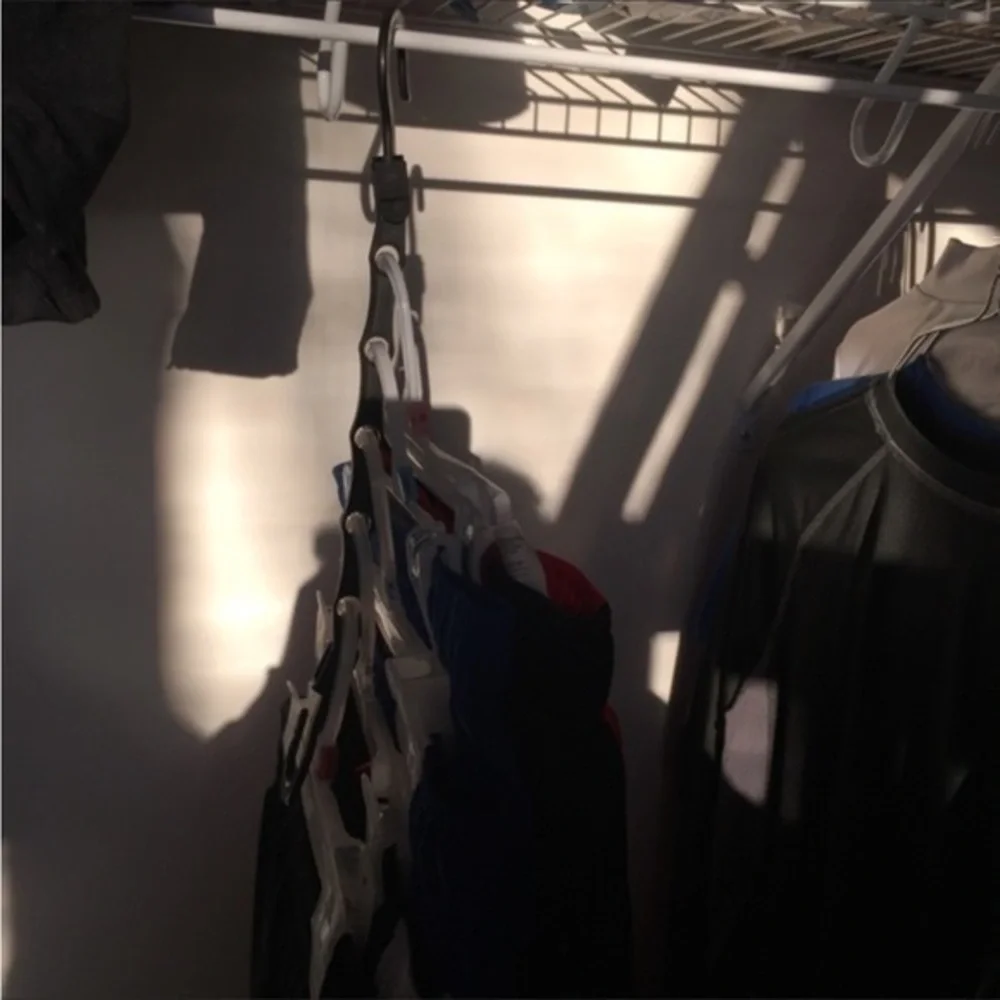 THE ULTIMATE SPACE SAVER: Wonder Hanger Max. Set includes 5 black Wonder Hangers
